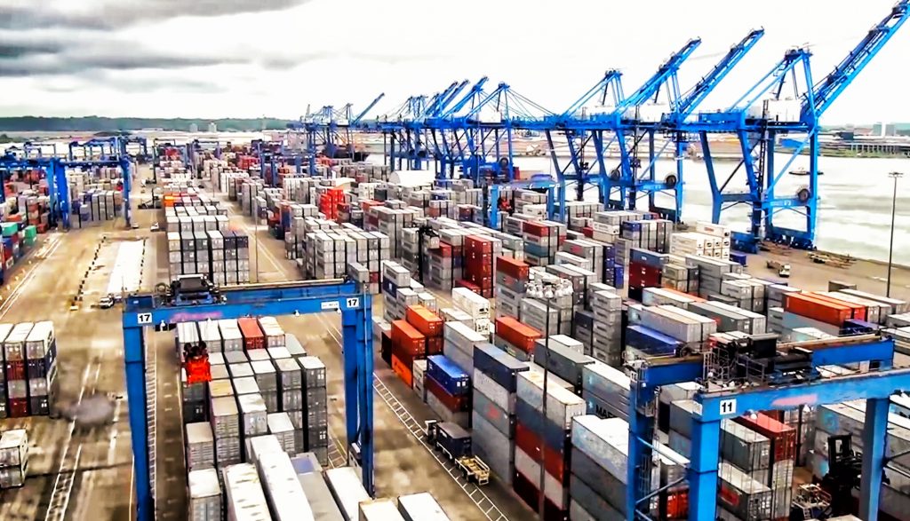 Cranes and containers at international logistics center port. Supply chain.